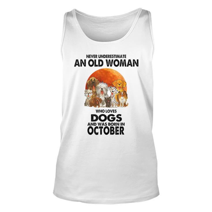 Never Underestimate An Old Woman Who Loves Dogs Born October Old Woman Tank Top