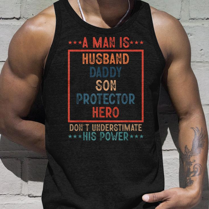 A Man Is Husband Daddy Son Protector Hero Fathers Day Unisex Tank Top Gifts for Him