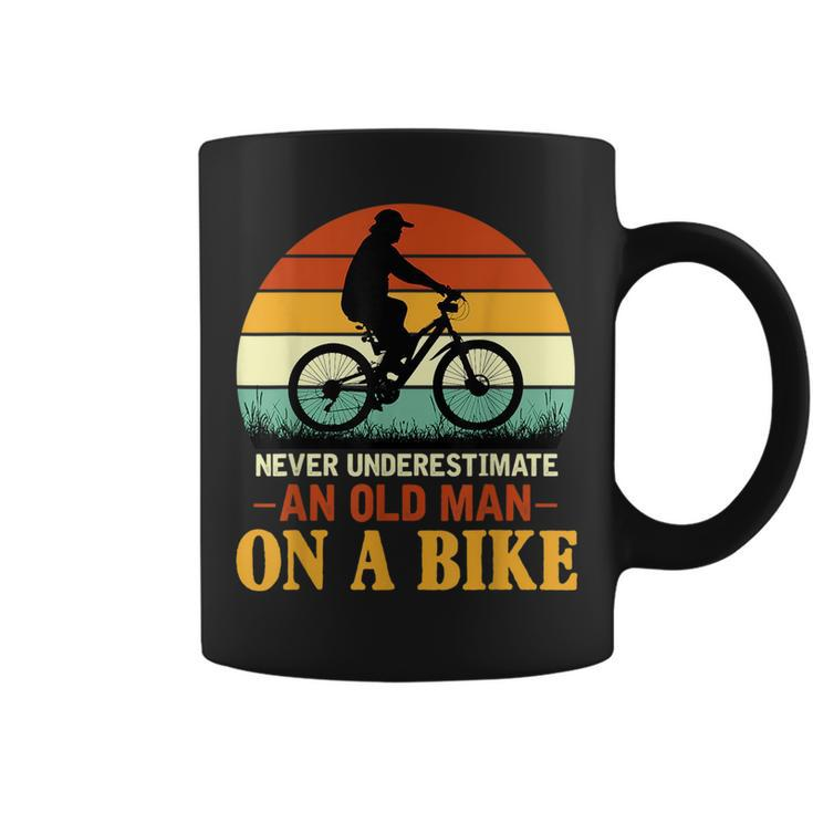 Never Underestimate Funny Quote An Old Man On A Bicycle Retr Coffee Mug