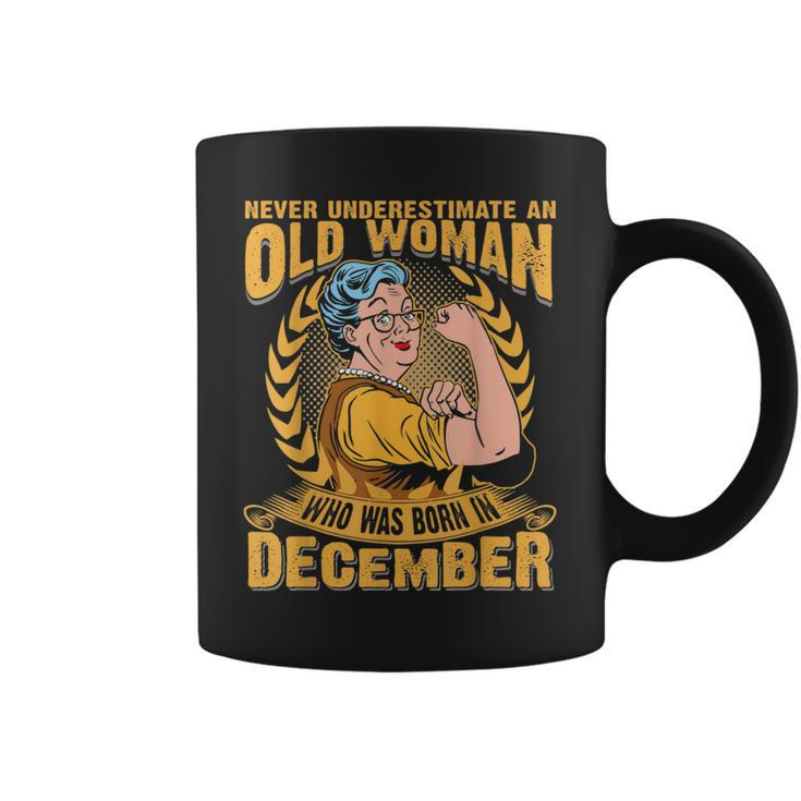 Never Underestimate An Old Woman Who Born In December Coffee Mug