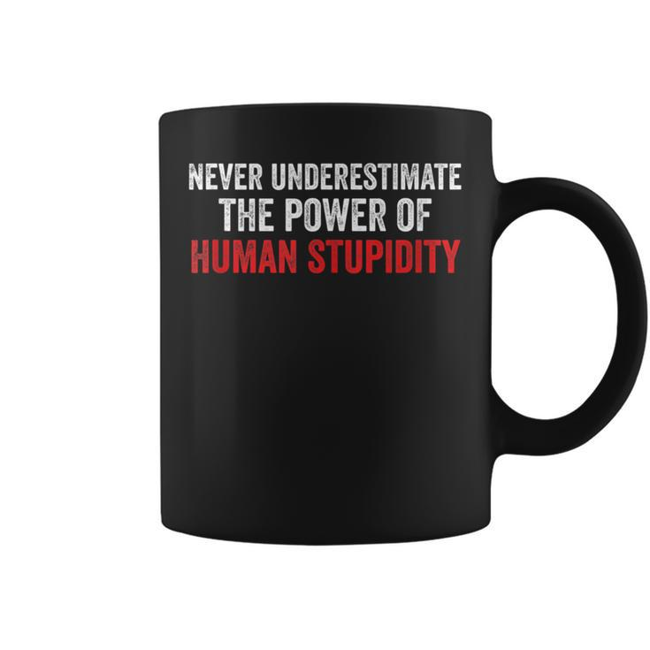 Never Underestimate The Power Of Human Stupidity Coffee Mug