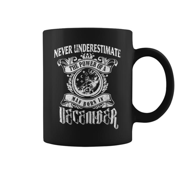 Never Underestimate The Power Of A Man December Coffee Mug