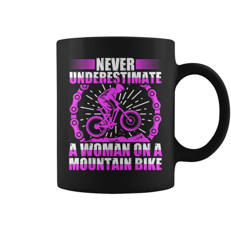 Never Underestimate A Woman On A Mountain Bike Coffee Mug