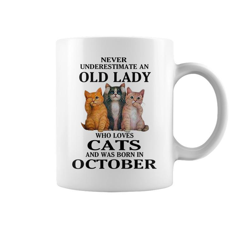 Never Underestimate An Old Lady Who Loves Cats Born October Coffee Mug