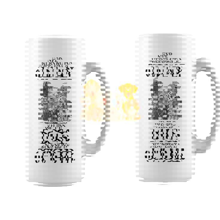 Never Underestimate An Old Lady Who Loves Dogs Born October Coffee Mug