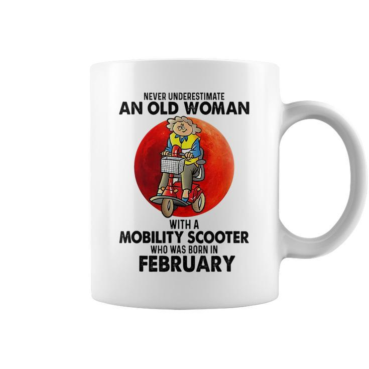 Never Underestimate An Old Woman Mobility Scooter February Old Woman Funny Gifts Coffee Mug