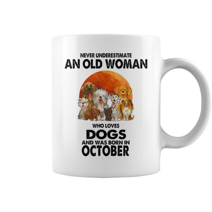 Never Underestimate An Old Woman Who Loves Dogs Born October Old Woman Funny Gifts Coffee Mug