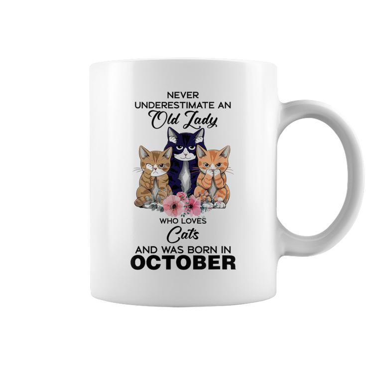 October Never Underestimate An Old Lady Who Loves Cats Coffee Mug