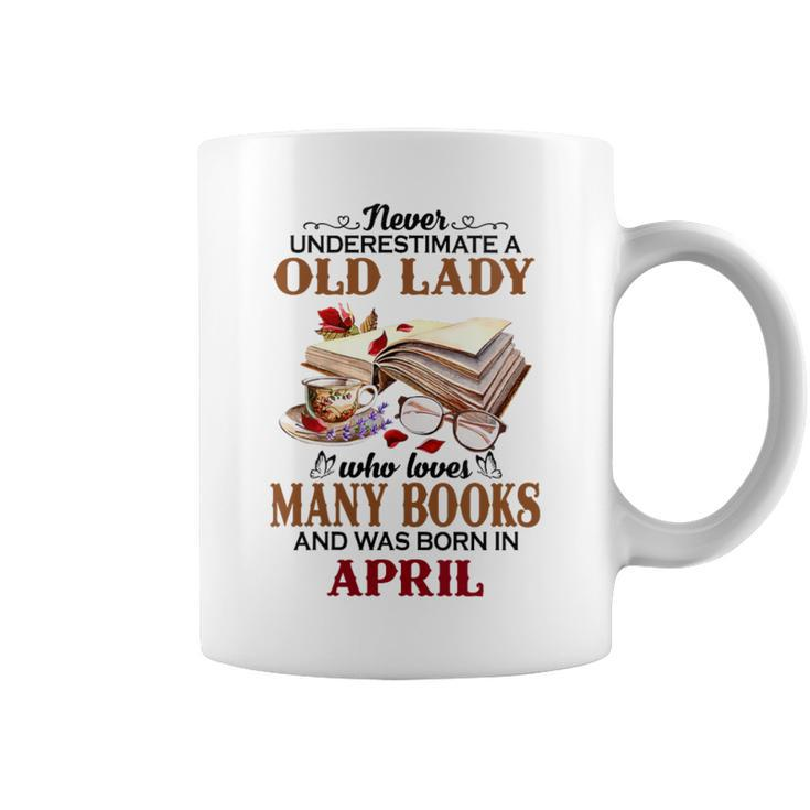 Never Underestimate A Old Lady Who Loves Many Books April Coffee Mug