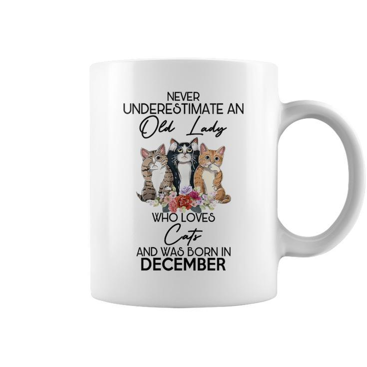 Never Underestimate An Old Lady Who Loves Cats December Coffee Mug