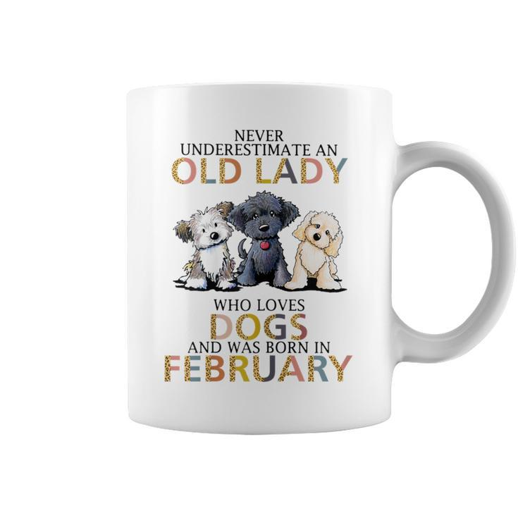 Never Underestimate Old Lady Loves Dogs Born In February Coffee Mug