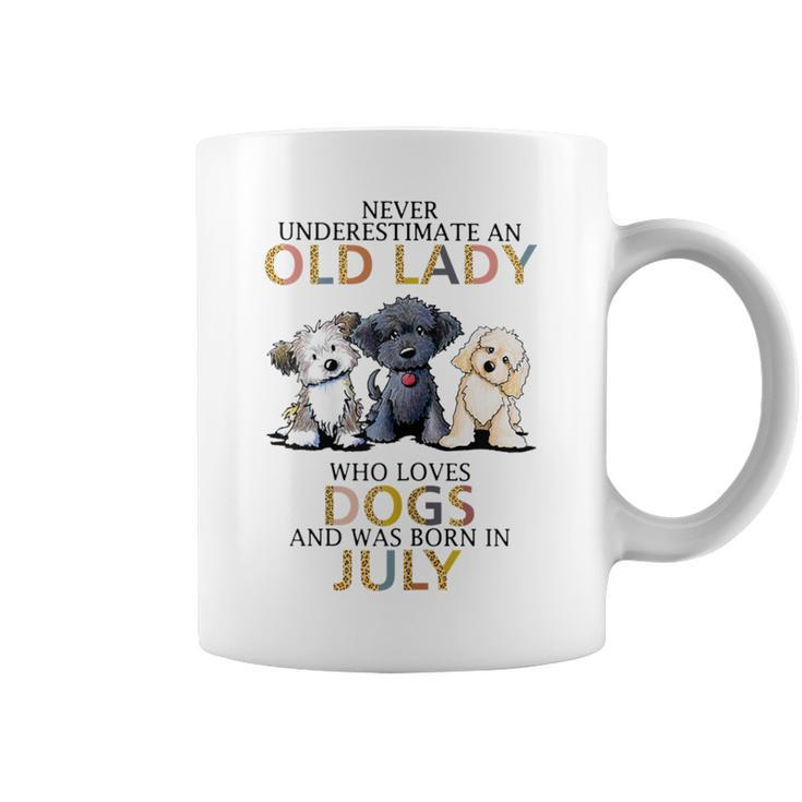 Never Underestimate Old Lady Loves Dogs Born In July Coffee Mug