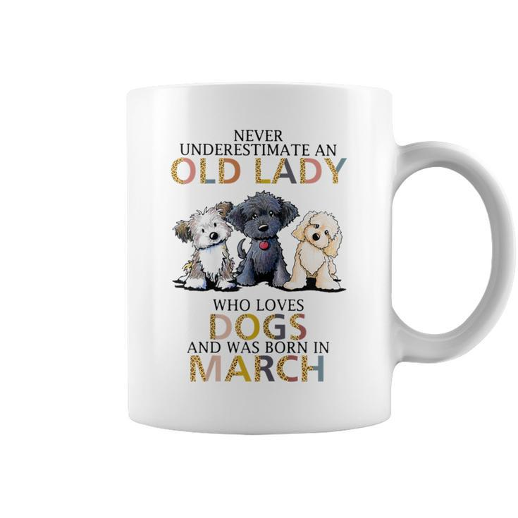 Never Underestimate Old Lady Loves Dogs Born In March Coffee Mug