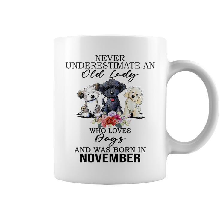 Never Underestimate An Old Lady Who Loves Dogs-November Coffee Mug