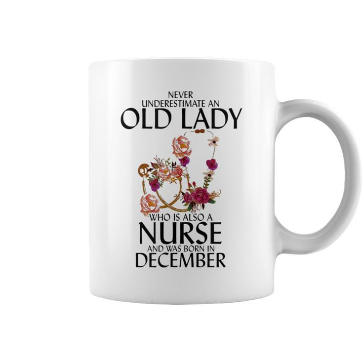 Never Underestimate An Old Lady Who Is Also A Nurse December Coffee Mug