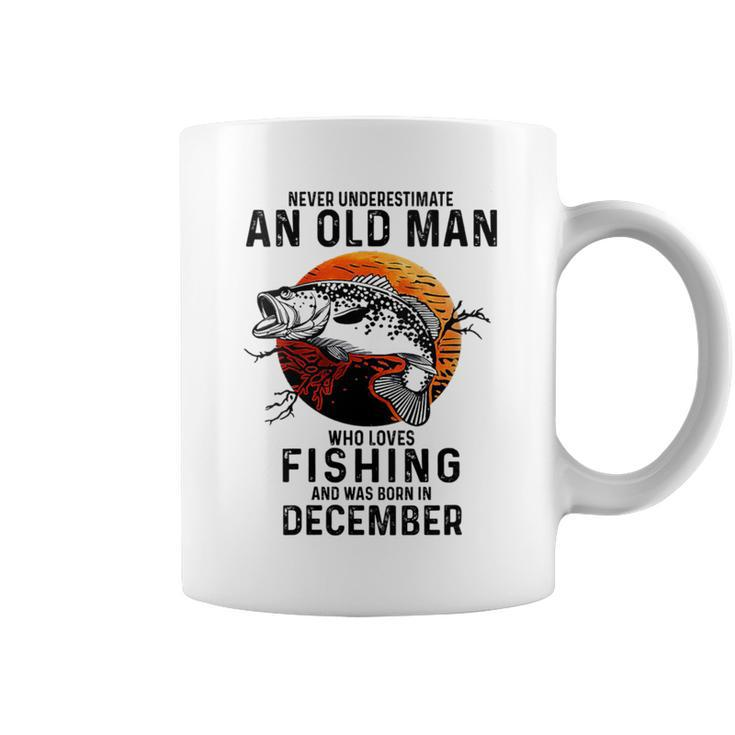 Never Underestimate An Old Man Loves Fishing December Coffee Mug