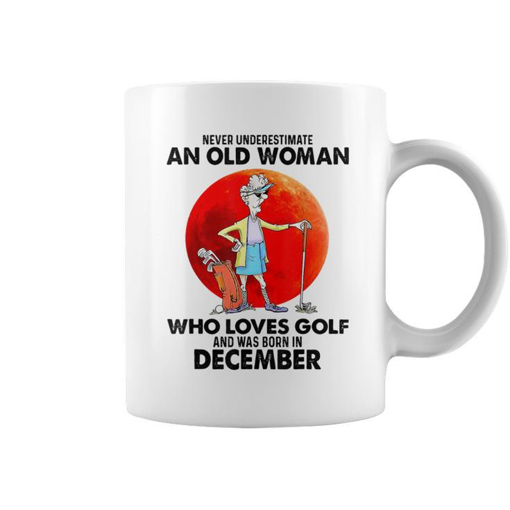 Never Underestimate An Old Woman Who Loves Golfs December Coffee Mug