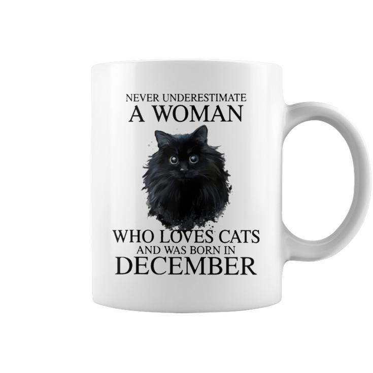 Never Underestimate A Woman Who Loves Cats Born In December Coffee Mug