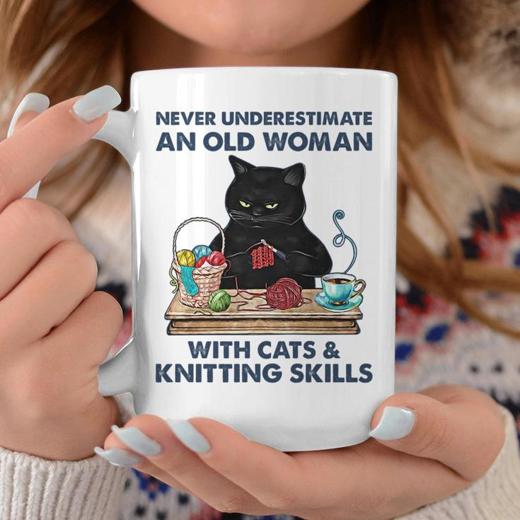 Never Underestimate And Old Woman With Cats And Knitting Coffee Mug Funny Gifts