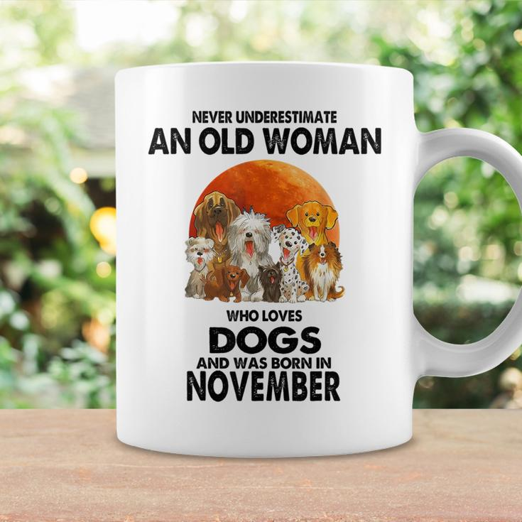 Never Underestimate An Old Woman Who Loves Dogs November Coffee Mug Gifts ideas