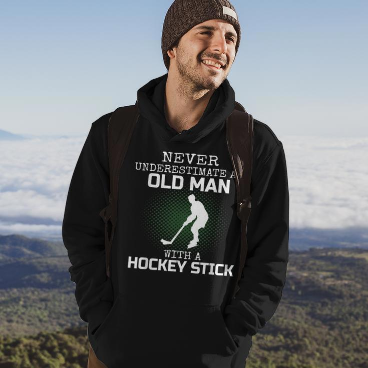 Never Underestimate An Old Man With A Hockey Stick Mens Dad Hoodie Lifestyle