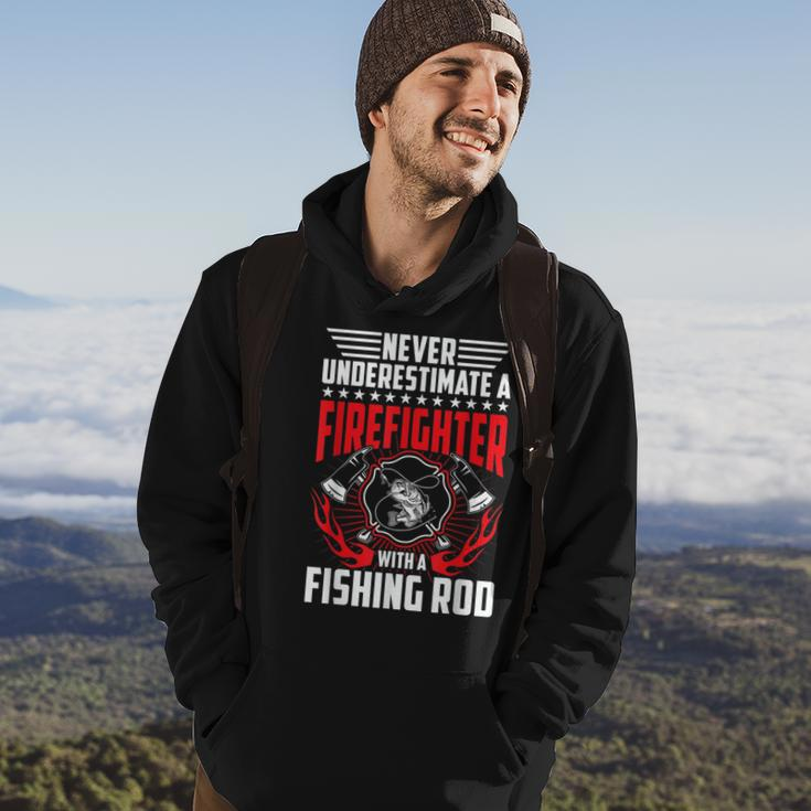 Never Underestimate Firefighter With Fishing Rod Gift Gift For Mens Hoodie Lifestyle