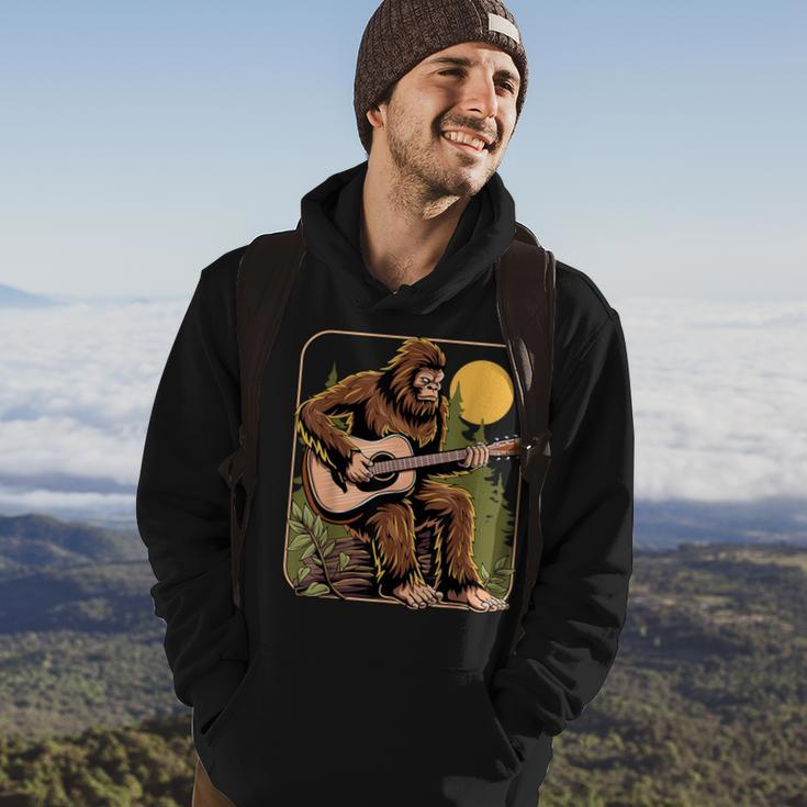Retro Bigfoot Sasquatch Playing Acoustic Guitar Guitarist Hoodie Lifestyle