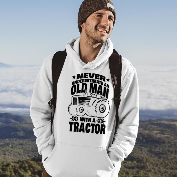 Never Underestimate An Old Man With A Tractor Farmer Dad Hoodie Lifestyle