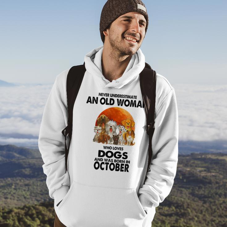 Never Underestimate An Old Woman Who Loves Dogs Born October Old Woman Funny Gifts Hoodie Lifestyle