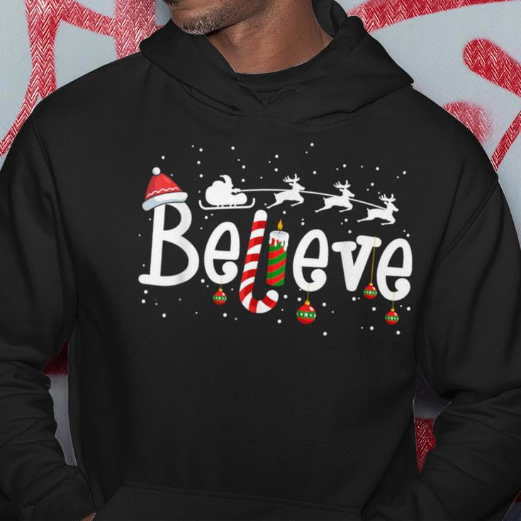 Believe Christmas Santa Claus Reindeer Candy Cane Xmas Hoodie Funny Gifts