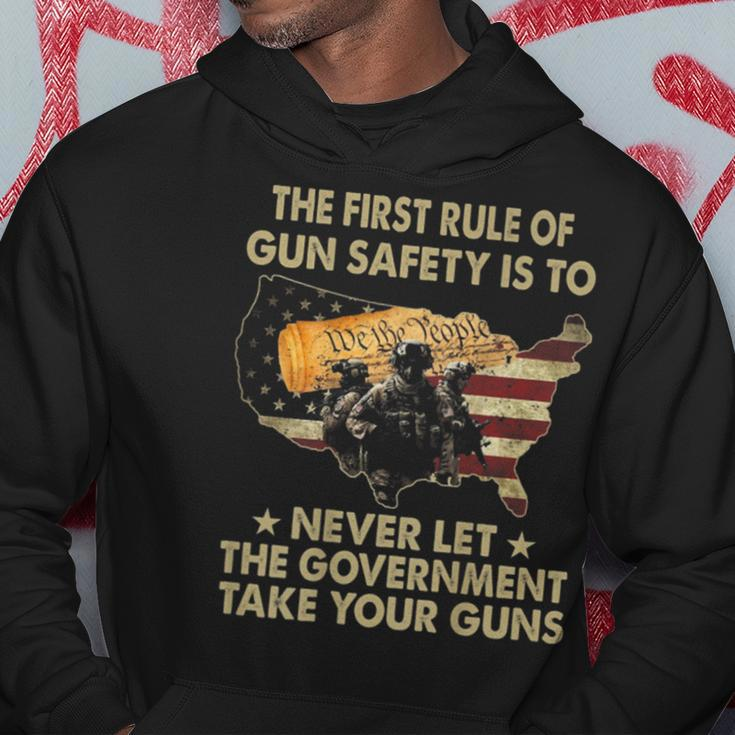 The First Rule Of Gun Safety Is To Never Let On Back Hoodie Unique Gifts