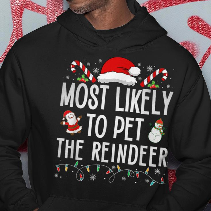 Most Likely To Pet The Reindeer Matching Christmas Hoodie Funny Gifts