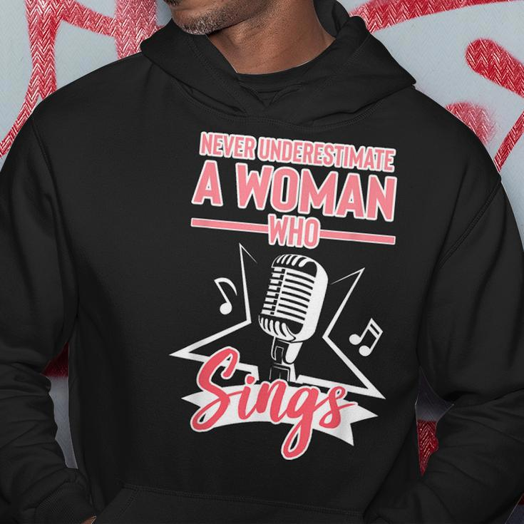 Never Underestimate A Woman Who Sings Lead Singer Singing Singer Funny Gifts Hoodie Unique Gifts