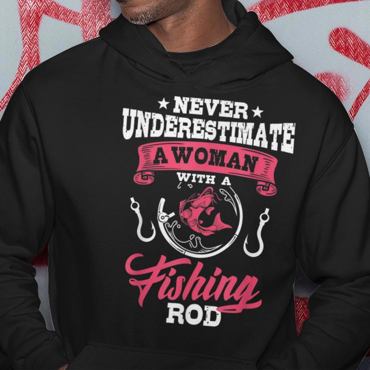Never Underestimate A Woman With A Fishing Rod Funny Fishing Fishing Rod Funny Gifts Hoodie Unique Gifts
