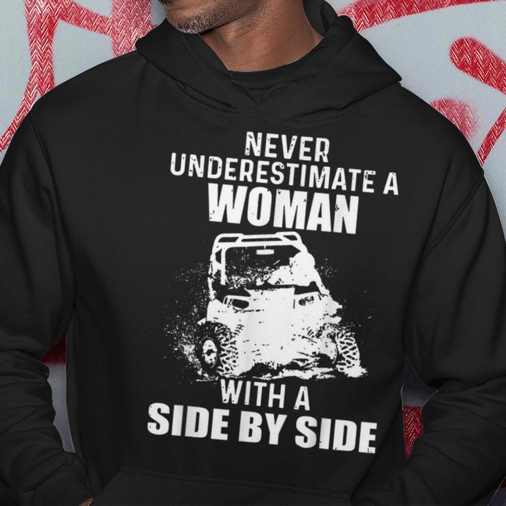Never Underestimate A Woman With A Side By Side Hoodie Unique Gifts