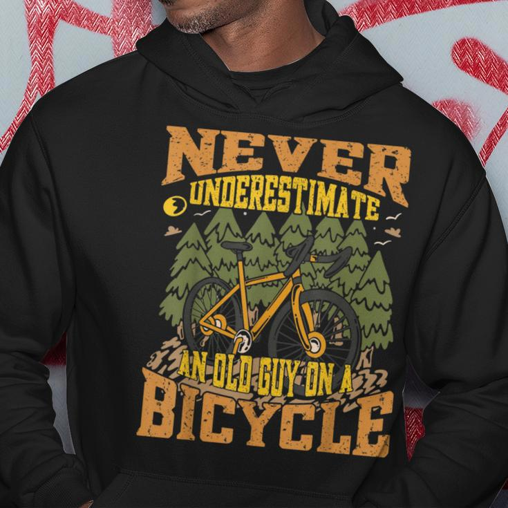 Never Underestimate An Old Guy On A Bicycle Funny Cycling Cycling Funny Gifts Hoodie Unique Gifts