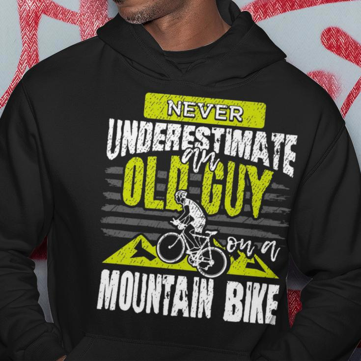 Never Underestimate An Old Guy On A Mountain Bike Cycling Cycling Funny Gifts Hoodie Unique Gifts