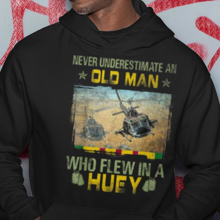 Never Underestimate An Old Man Who Flew In A Huey Hoodie Unique Gifts