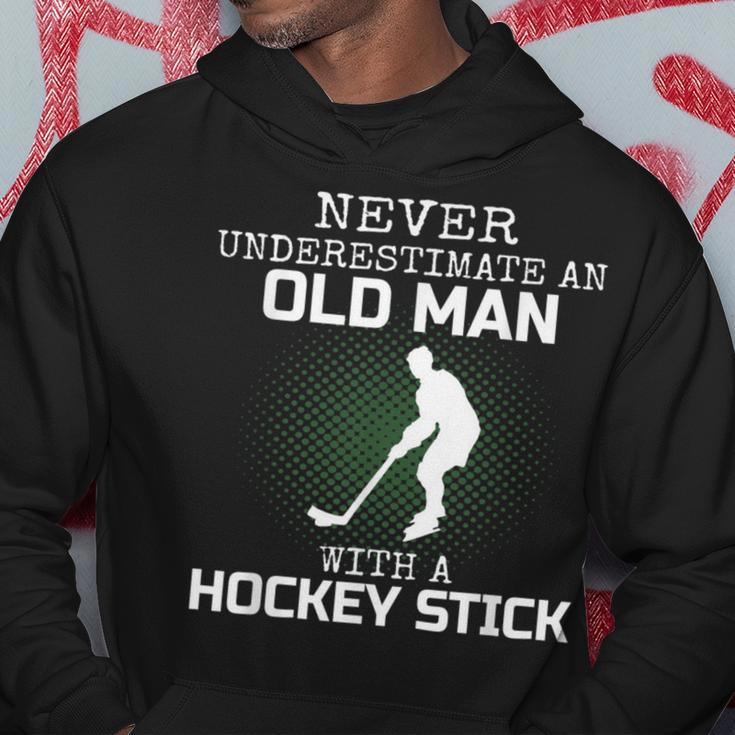 Never Underestimate An Old Man With A Hockey Stick Mens Dad Hoodie Funny Gifts