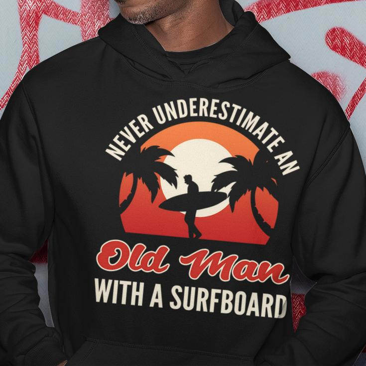 Never Underestimate An Old Man With A Surfboard Surfer Hoodie Funny Gifts
