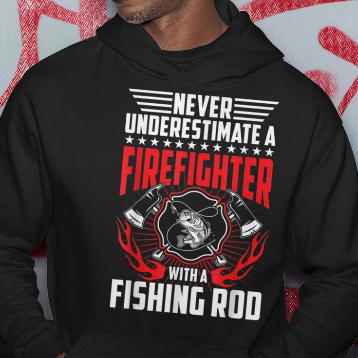 Never Underestimate Firefighter With Fishing Rod Gift Gift For Mens Hoodie Unique Gifts
