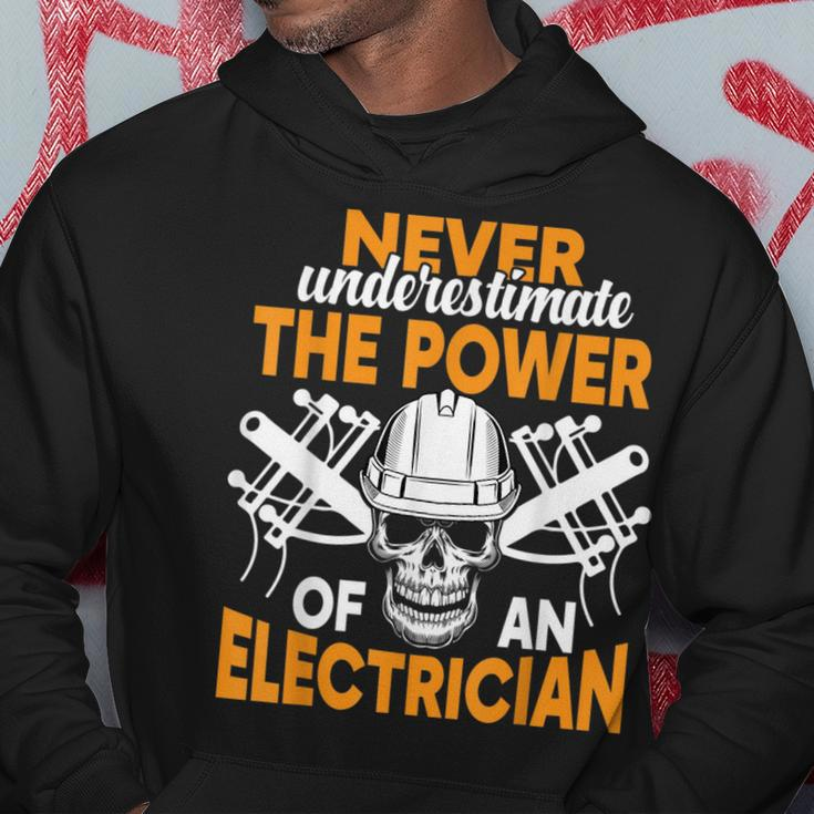 Never Underestimate The Power Of An Electrician Electrician Funny Gifts Hoodie Unique Gifts