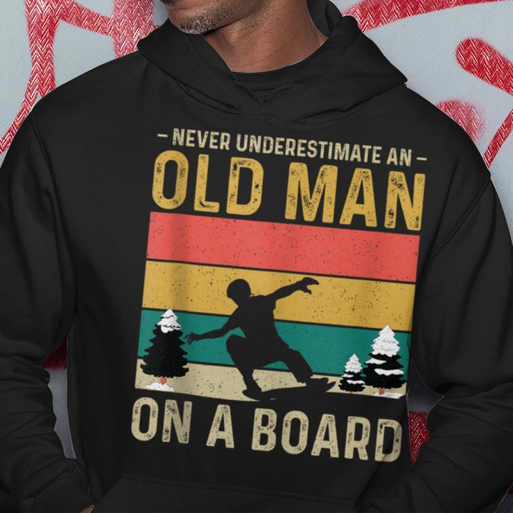 Never Underestimate An Old Man On A Snowboard Vintage Hoodie Funny Gifts