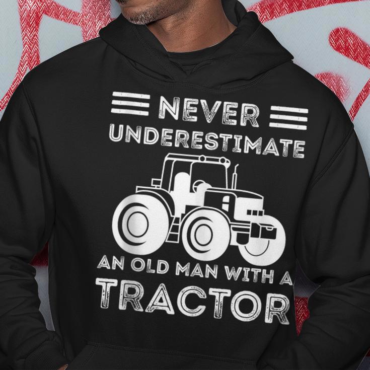 Never Underestimate An Old Man With A Tractor Farmers Hoodie Funny Gifts