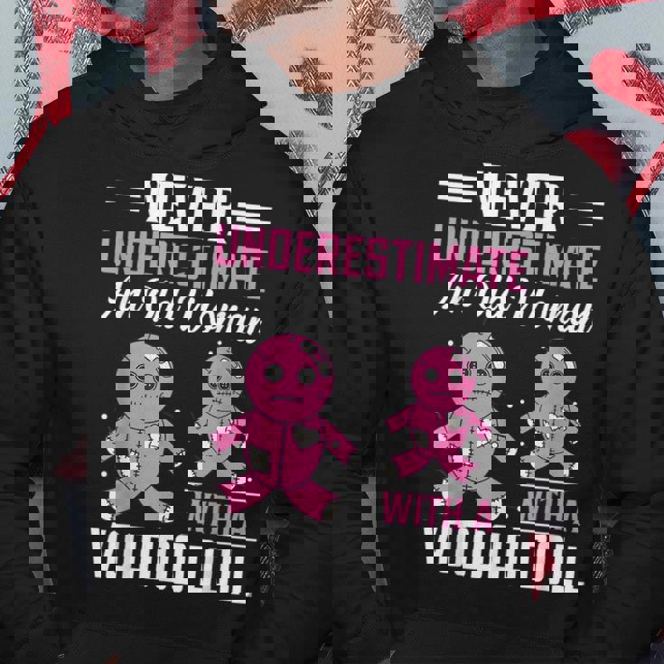 Never Underestimate An Old Woman With A Voodoo Doll Old Woman Hoodie Unique Gifts
