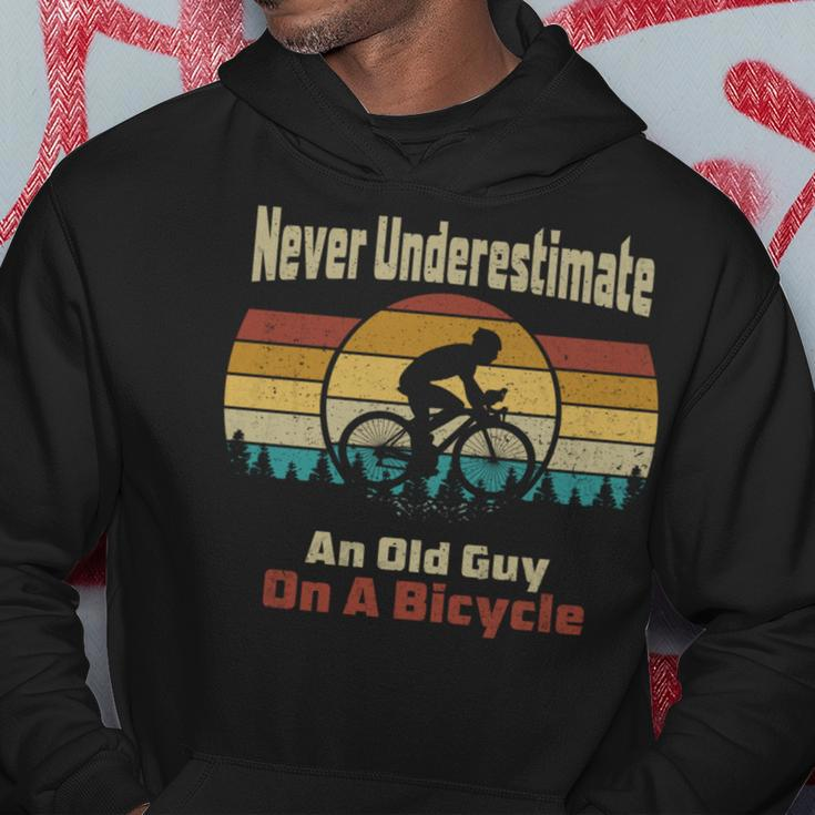 Vintage Cycling Never Underestimate An Old Guy On A Bicycle Cycling Funny Gifts Hoodie Unique Gifts