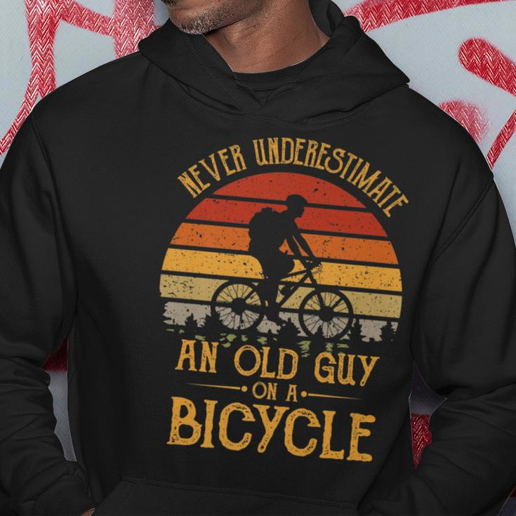 Vintage Never Underestimate An Old Guy On A Bicycle Cycling Gift For Mens Hoodie Unique Gifts