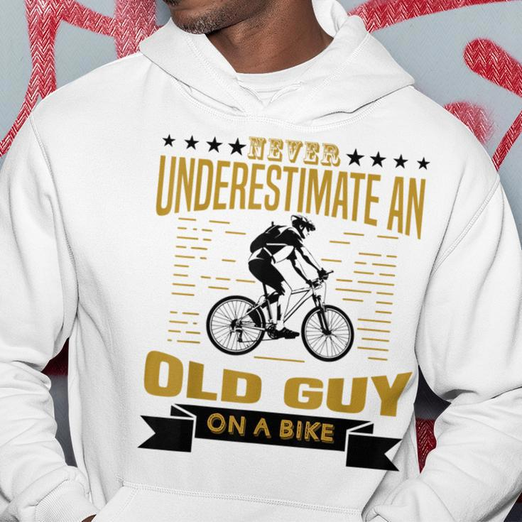 Never Underestimate An Old Guy On A Bicycle Cycling Lover Cycling Funny Gifts Hoodie Unique Gifts