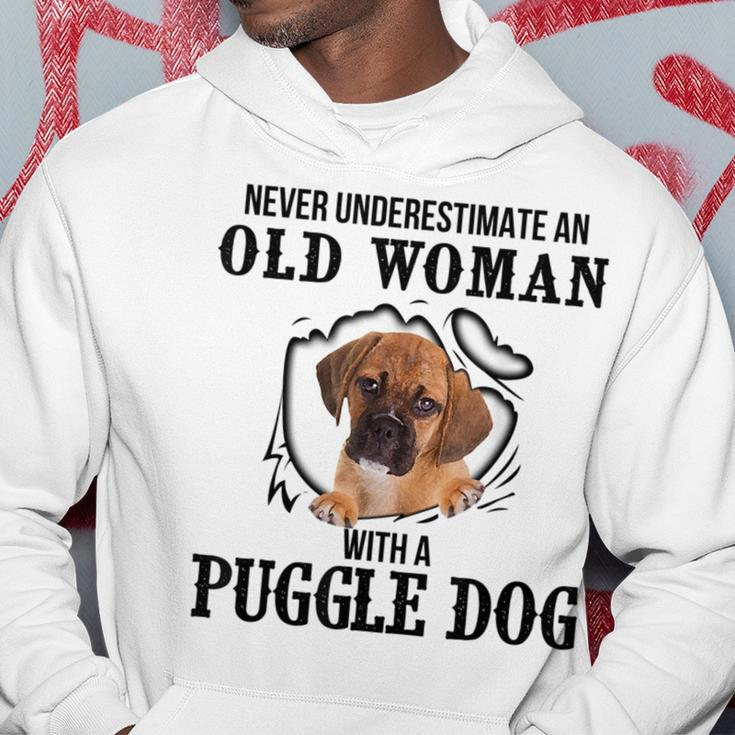 Never Underestimate An Old Woman With A Puggle Dog Old Woman Funny Gifts Hoodie Unique Gifts