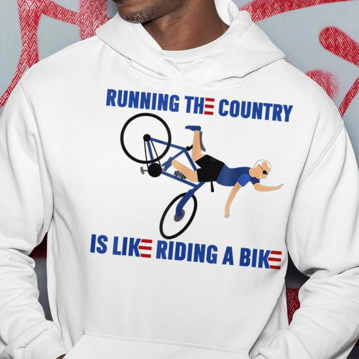 Running The Country Is Like Riding A Bike Joe Biden Funny Running Funny Gifts Hoodie Unique Gifts